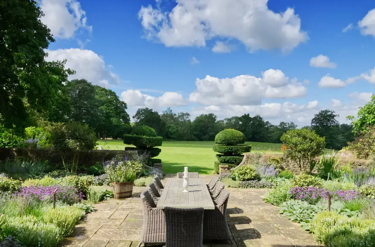 Views across a Hampshire garden from the country house terrace